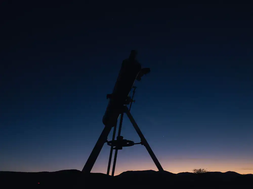 Display of various astronomical telescopes on tripods